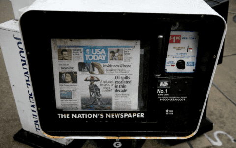 Newspaper dispenser with a copy of USA Today